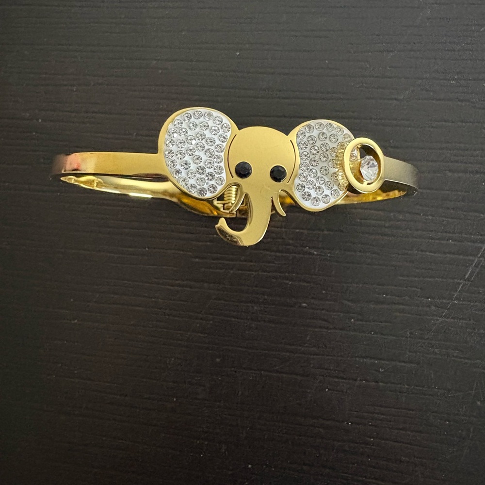 Newei hinged bracelet gold plated with elephant design. New.